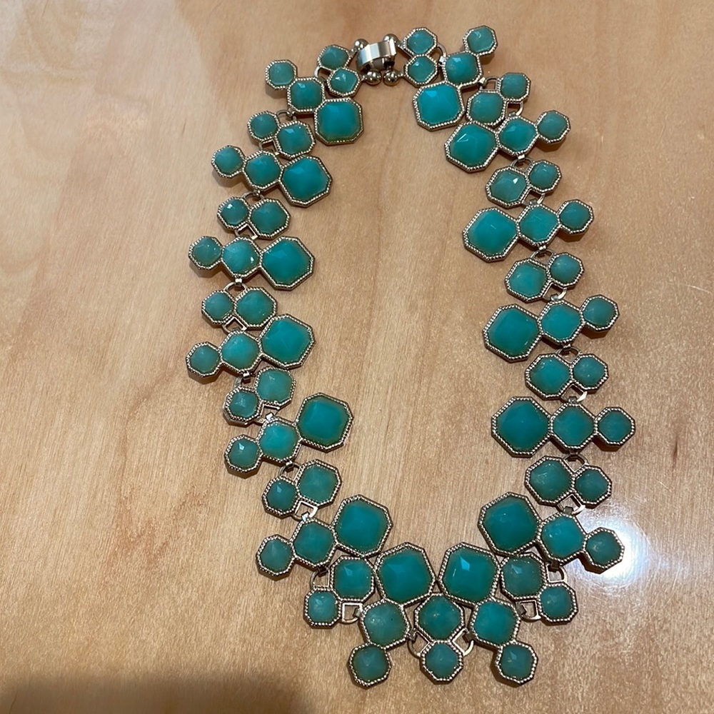 Short jade green necklace.